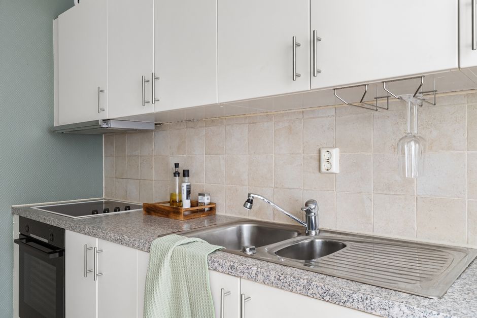 Completed modern kitchen remodeling with new cabinets and countertops